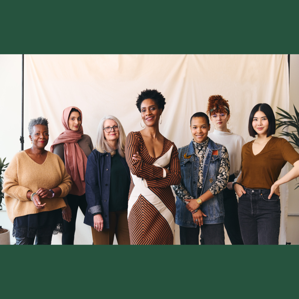 Multicultural women standing proudly together